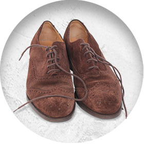 A photo of a pair of brown suede brogues