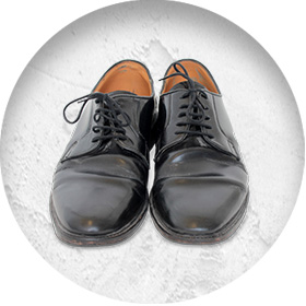 A photo of a pair of smart black leather shoes.
